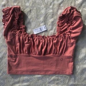 - brand new pacsun pink crop top with ruffles